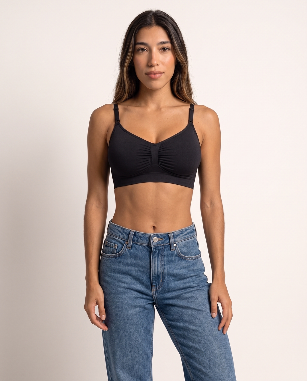Model standing with arms down in the Wireless Shaping Bra in black