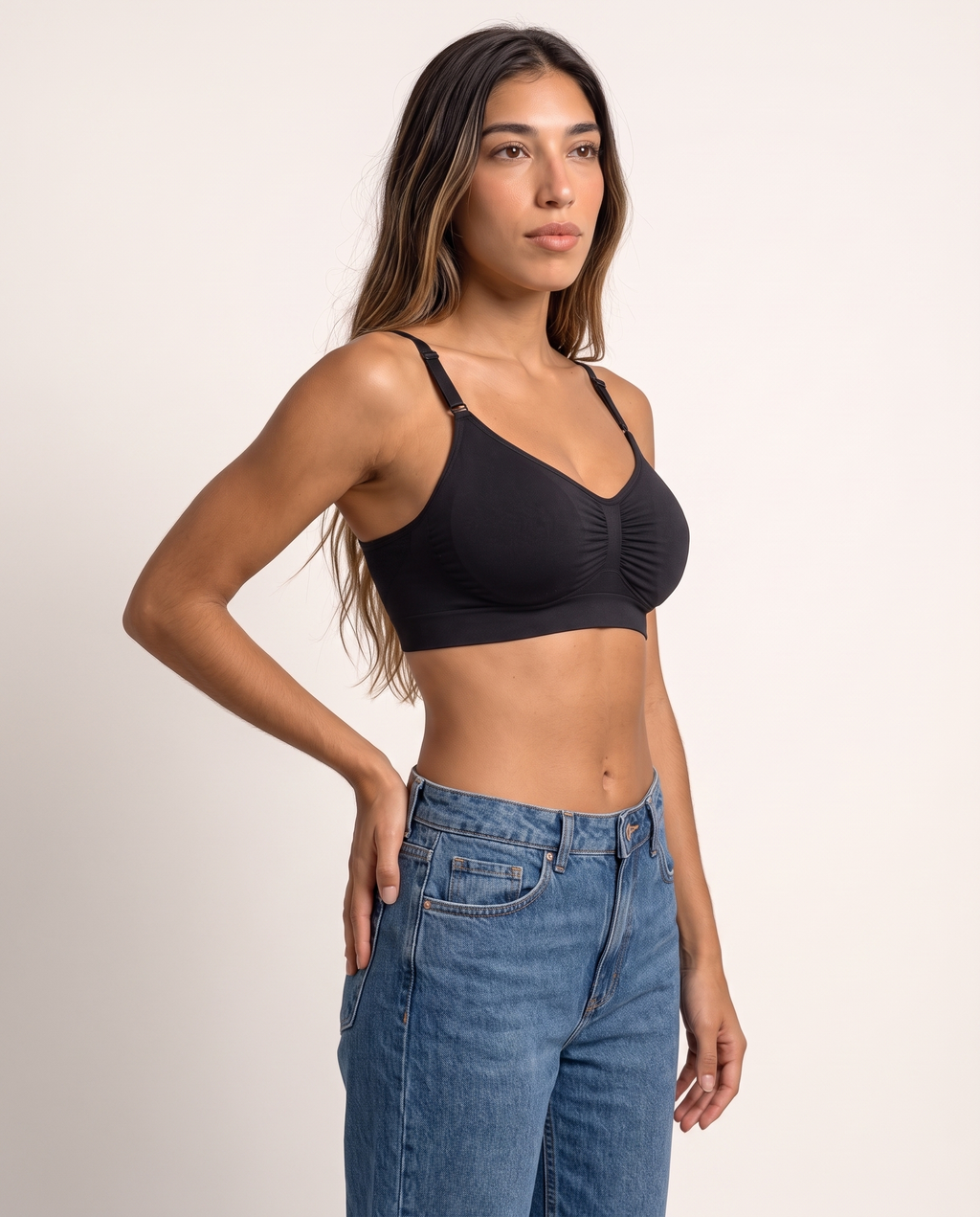Model in a three-quarter turn wearing the Wireless Shaping Bra in black