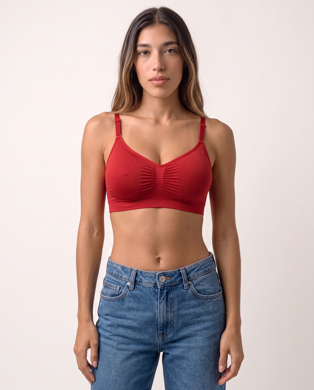 Model standing in the Wireless Shaping Bra in red
