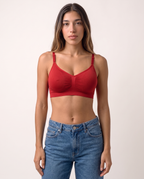 Model standing in the Wireless Shaping Bra in red