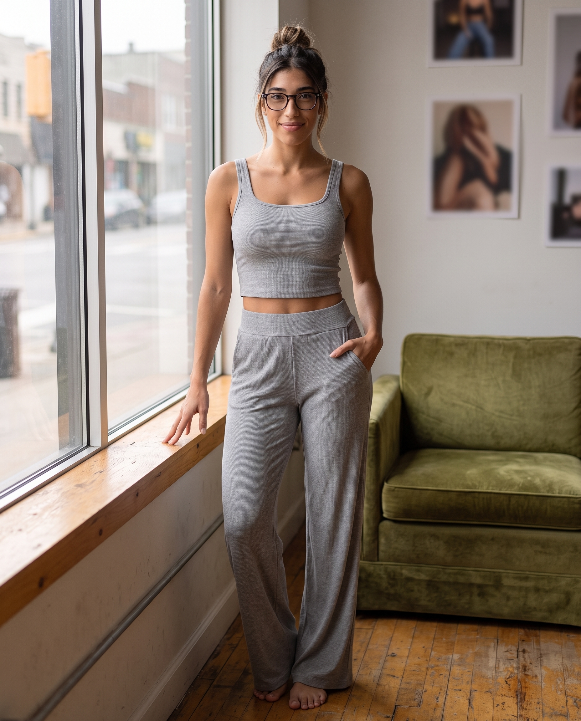 Model wearing the Ribbed Lounge Tank Top in gray by a sunlit window