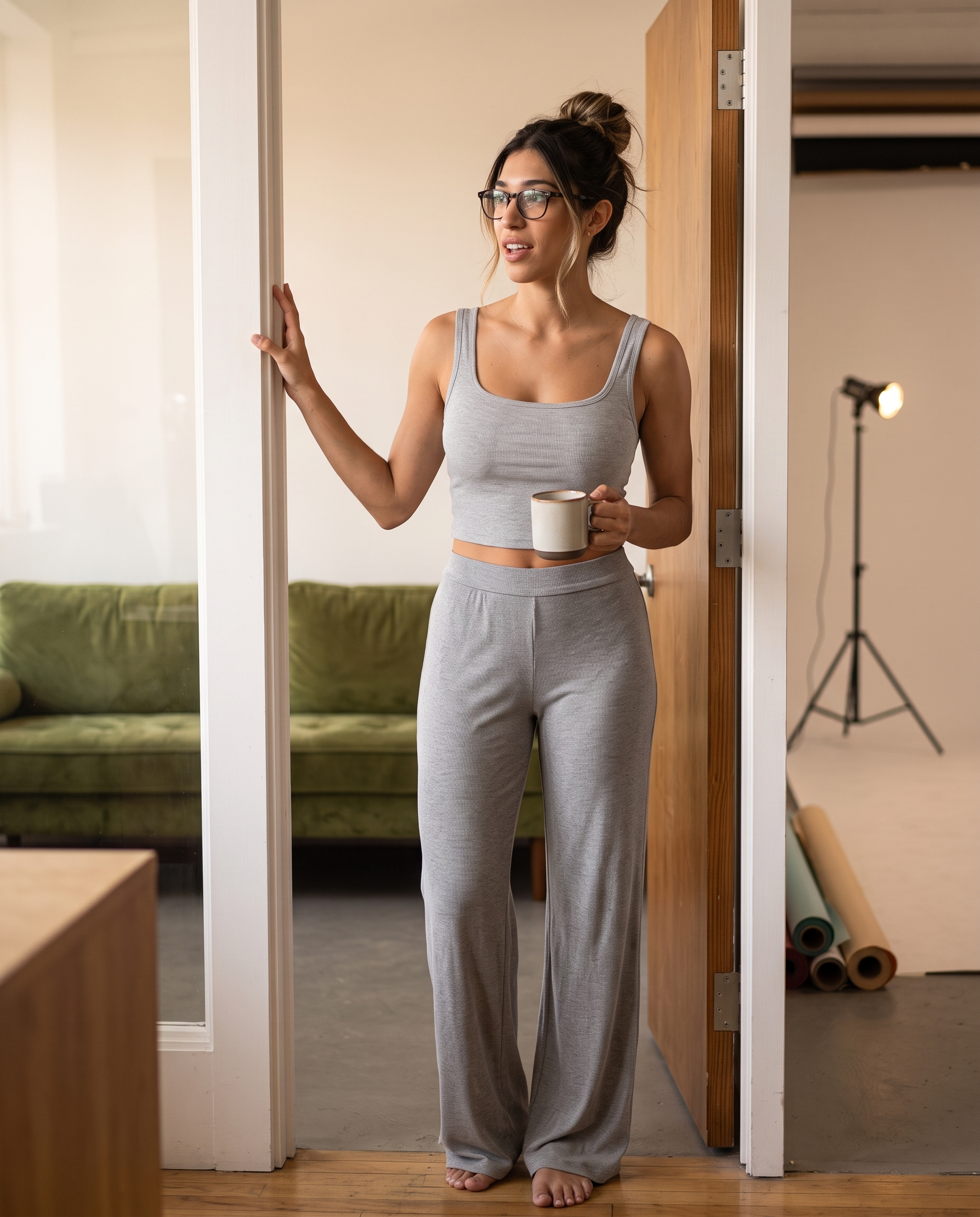 Model in a doorway wearing the gray Ribbed Lounge Tank Top and lounge pants