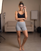 Model wearing the Ribbed Lounge Boxer Short in gray with matching bra top, front view
