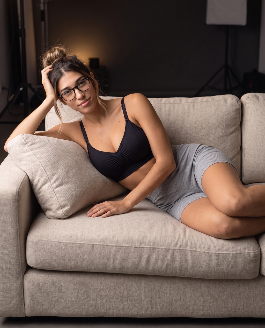 Model seated on a couch in the gray Ribbed Lounge Boxer Short, side view