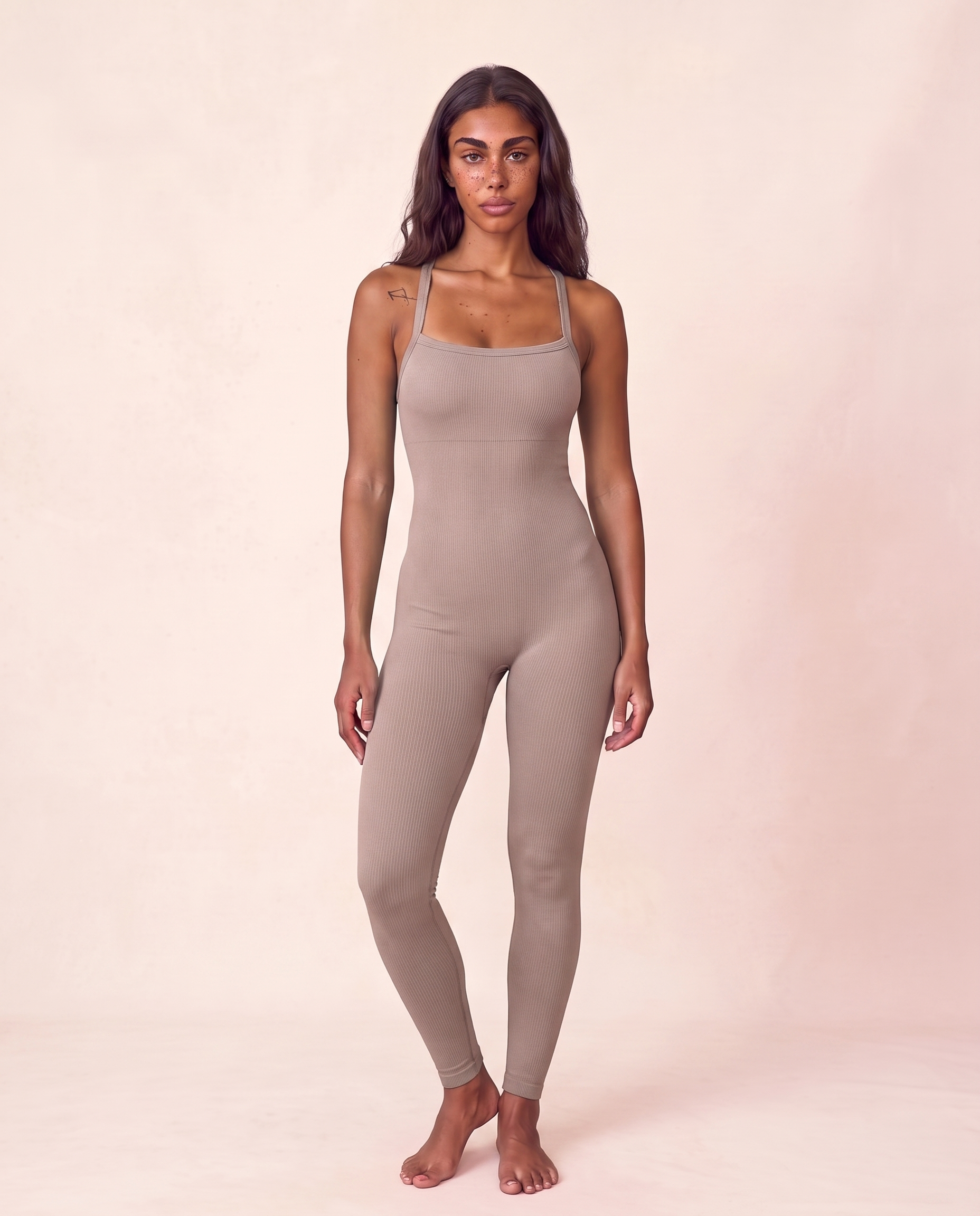 Front three-quarter view of the Bra-Free Shaping Jumpsuit in Light Brown, shown in the matched pose used for colour comparison.