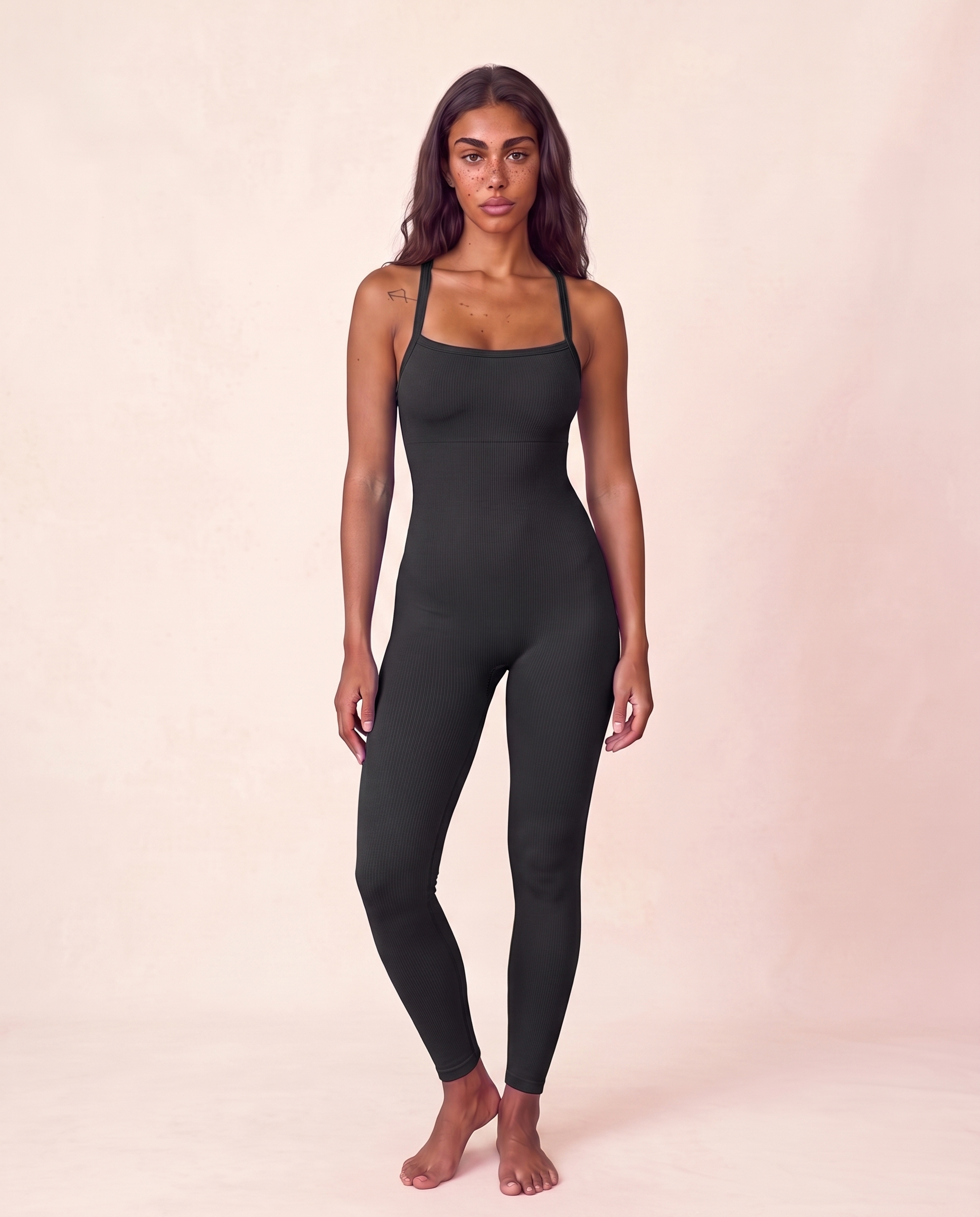 Front three-quarter view of the Bra-Free Shaping Jumpsuit in Black, shown in the matched pose used for colour comparison.