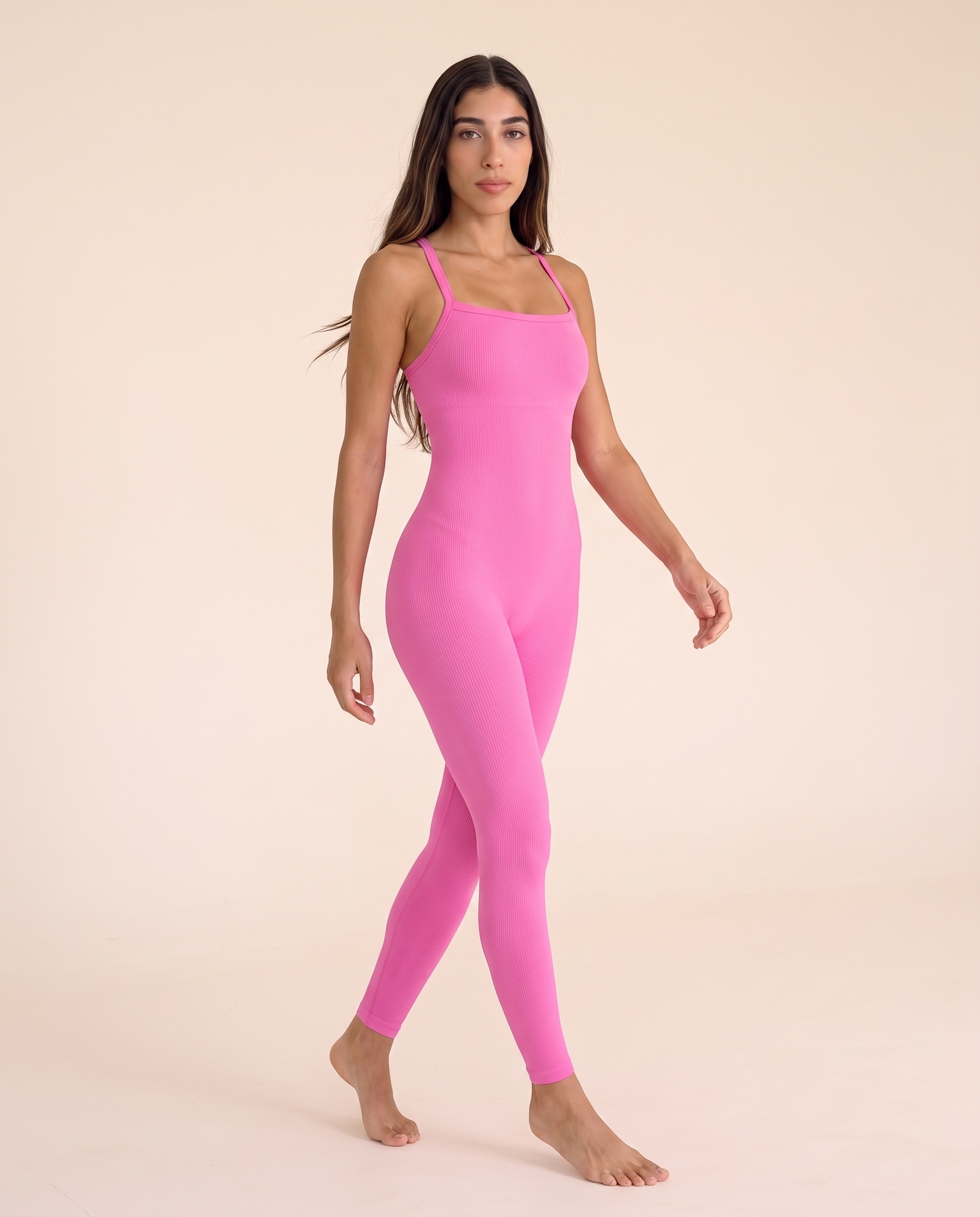Three-quarter turning view of the Bra-Free Shaping Jumpsuit in Blush Pink.
