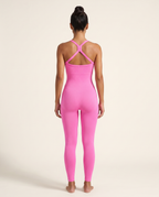Straight-on rear view of the Bra-Free Shaping Jumpsuit in Blush Pink, showing the centre-X back and seamless leg.