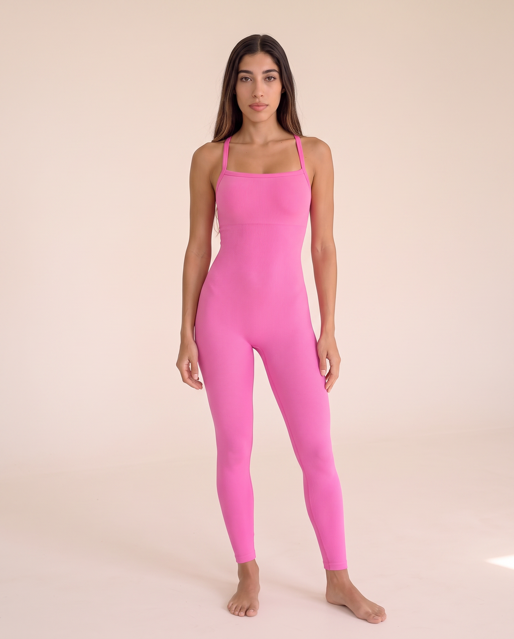 Front three-quarter view of the Bra-Free Shaping Jumpsuit in Blush Pink.
