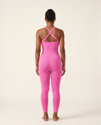 Straight-on rear view of the Bra-Free Shaping Jumpsuit in Blush Pink.
