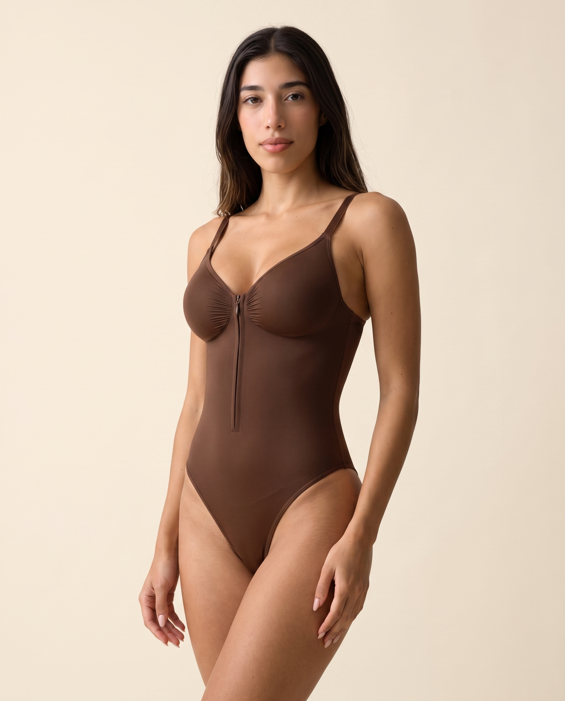 Front three-quarter view of the Plunge Chest-Support Bodysuit in Mocha Brown, fully zipped.