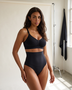 No-Show Tummy Control Thong in Black — front view.
