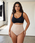 No-Show Tummy Control Thong in Light Nude — side view.