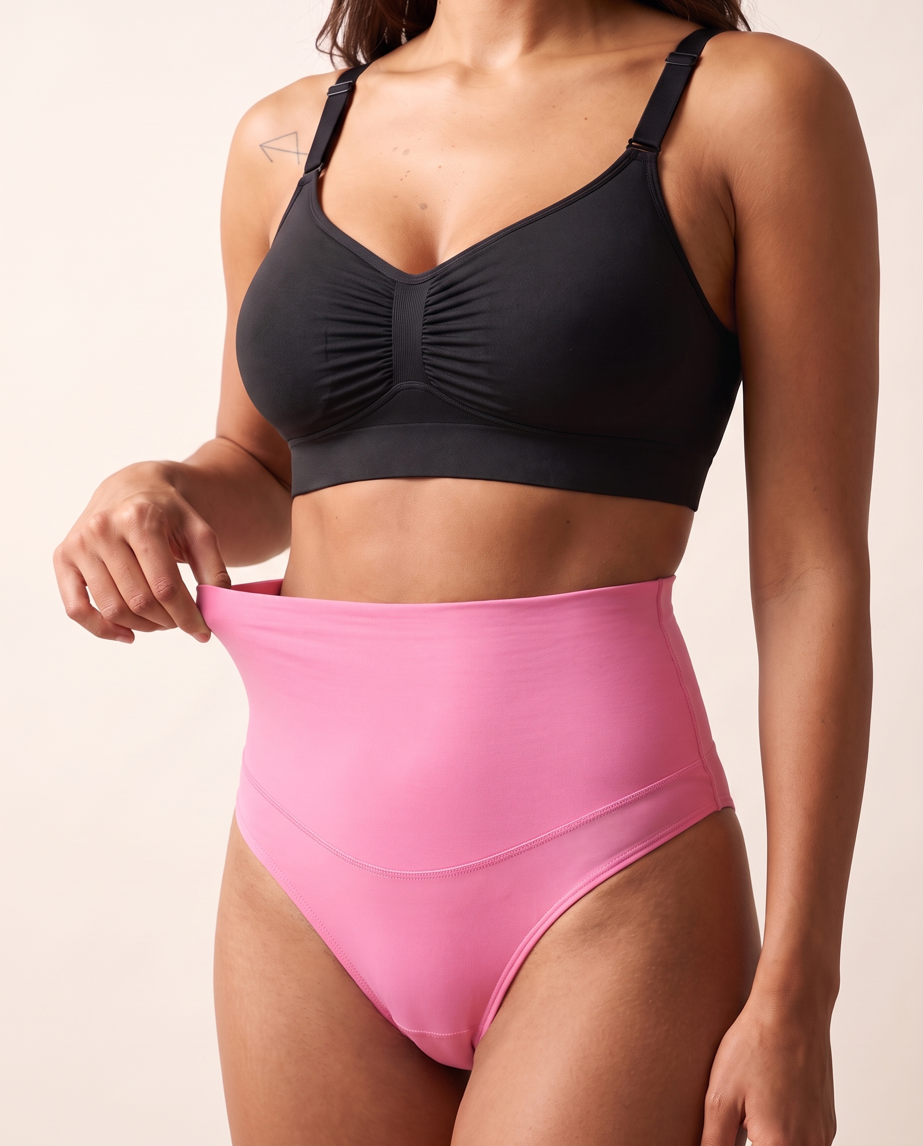 No-Show Tummy Control Thong in Blush Pink — three-quarter product close-up.