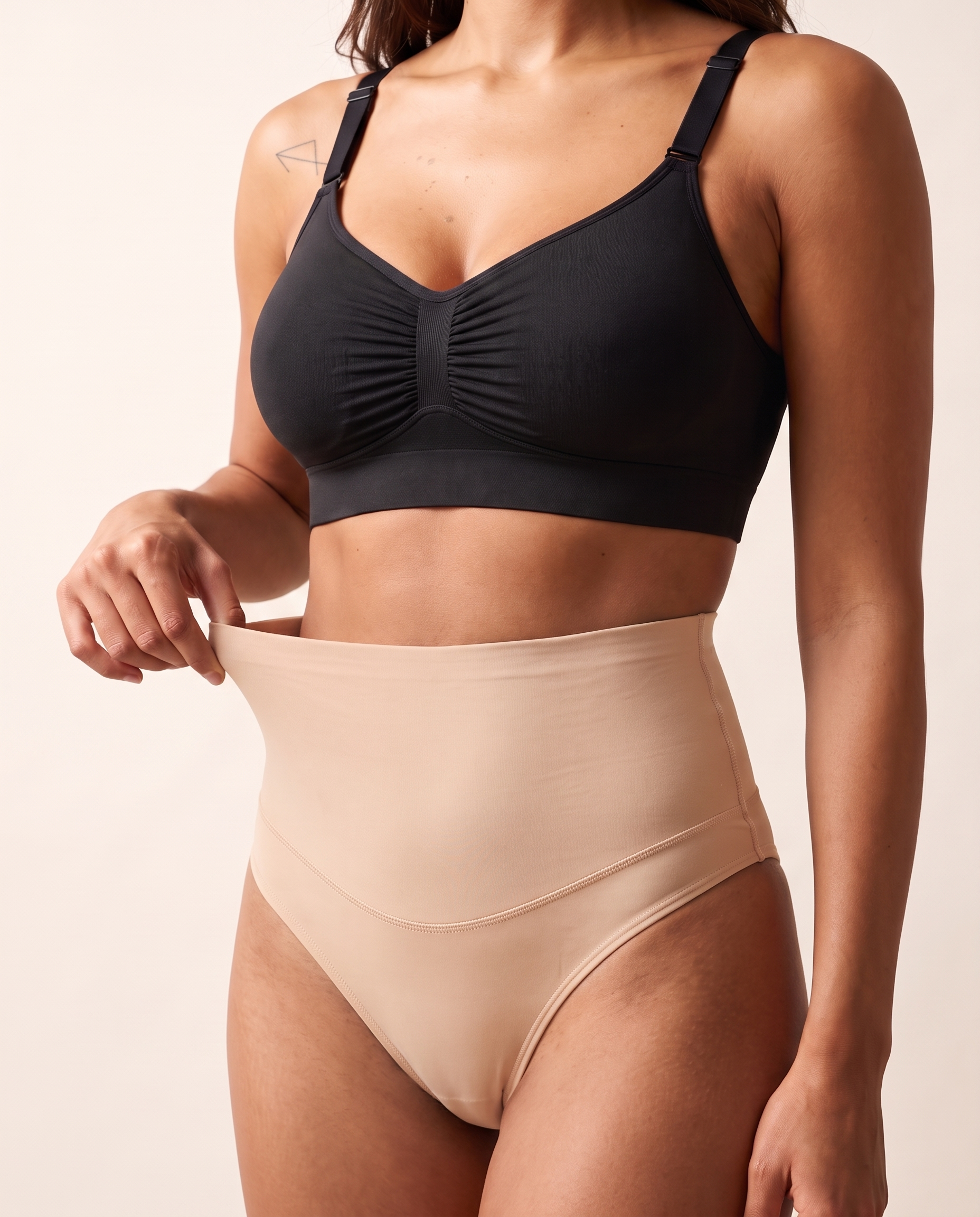 No-Show Tummy Control Thong in Light Nude — three-quarter product close-up.