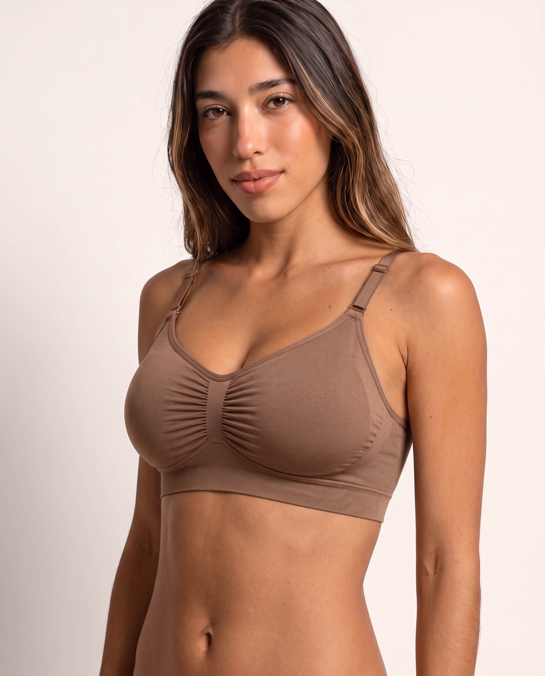 Model wearing the Wireless Shaping Bra in deep nude, three-quarter view