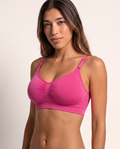 Model wearing the Wireless Shaping Bra in hot pink, three-quarter view