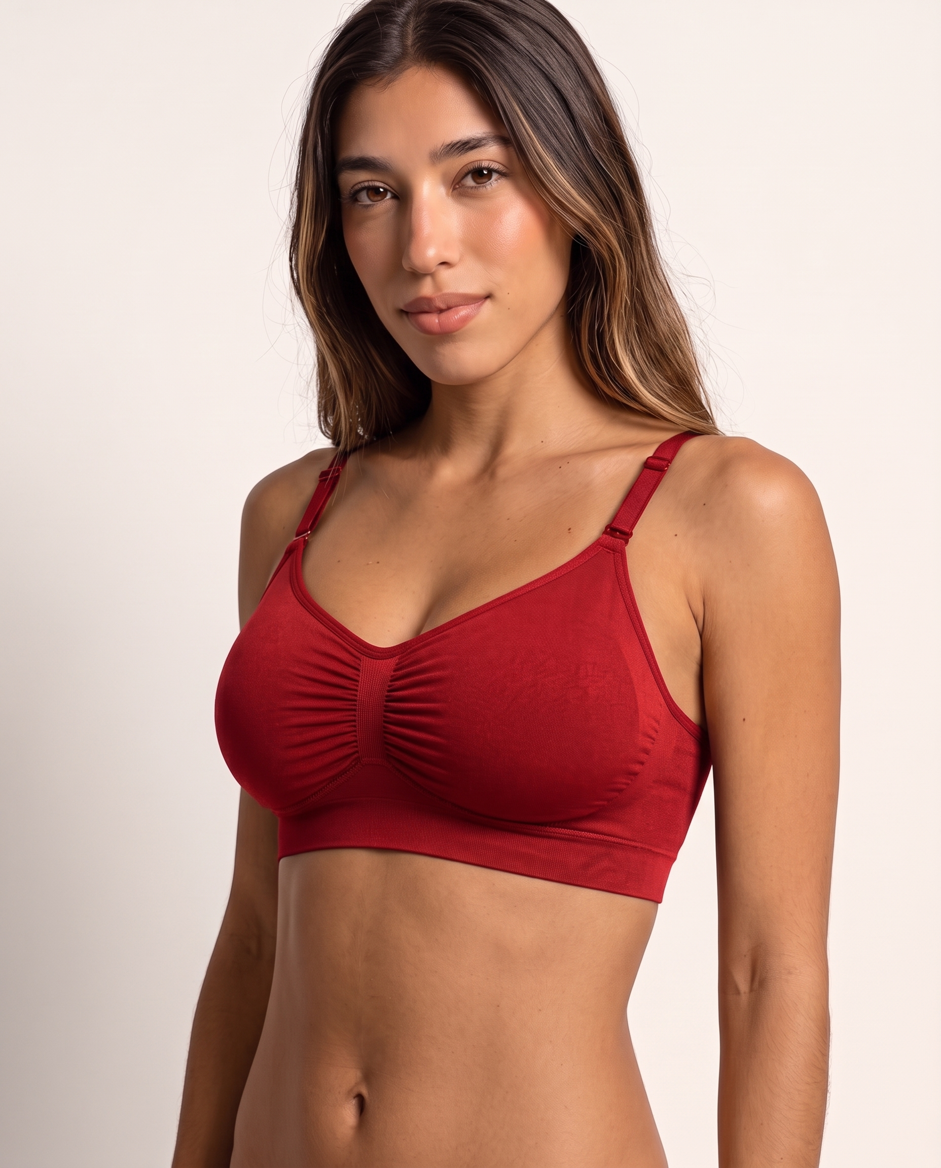 Model wearing the Wireless Shaping Bra in red, three-quarter view
