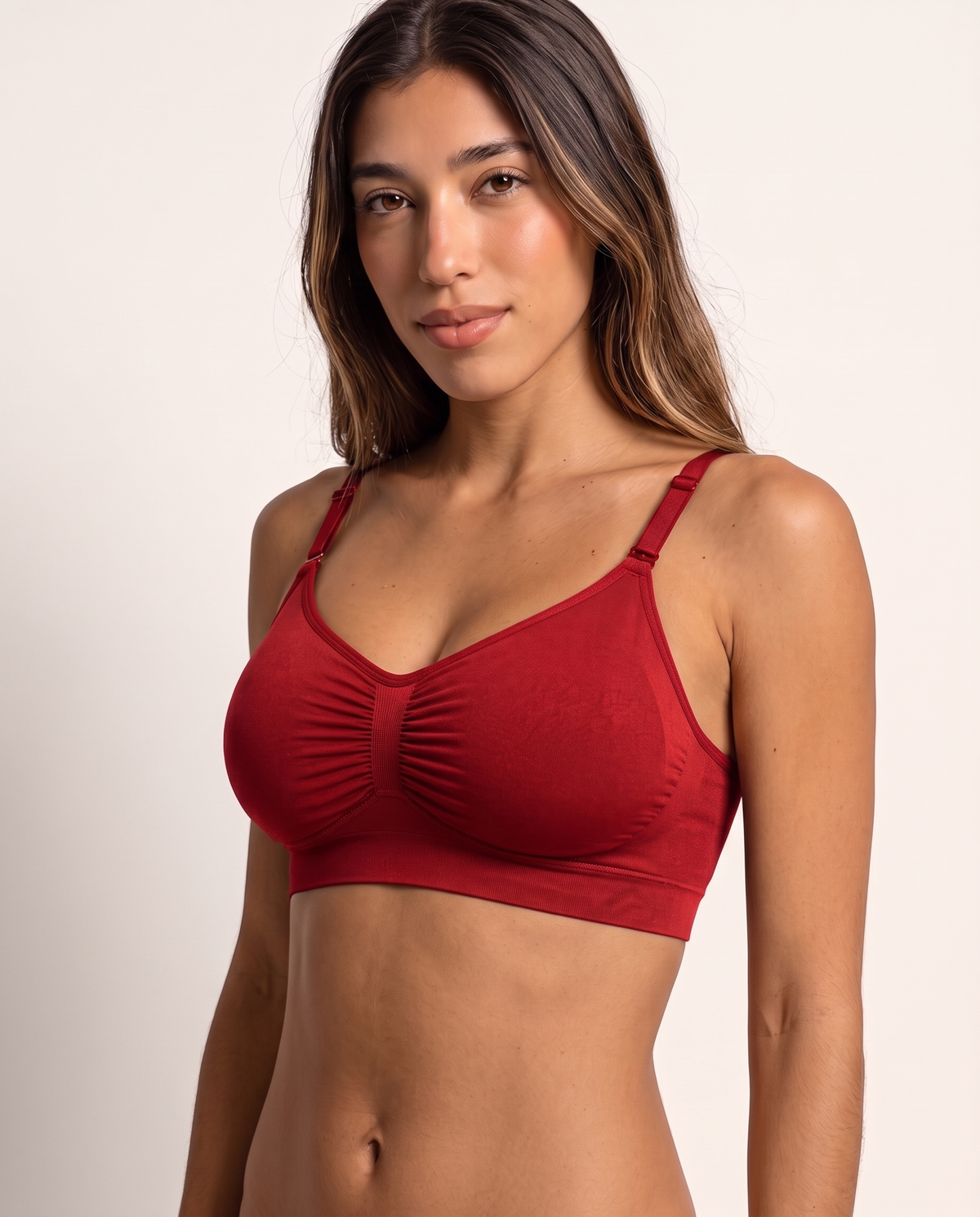 Model wearing the Everyday Wireless Bra in red, three-quarter view